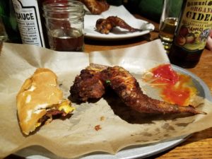 Smoked wings and last burger bite